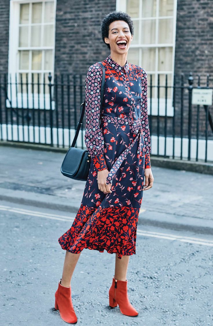A boho mix of sweet floral prints enlivens a woven shirtdress in a demure A-line cut wrapped with a sash.
