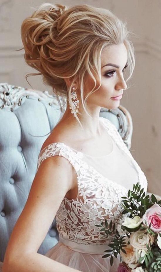 a woman in a wedding dress holding a bouquet and looking at the camera with an instagram