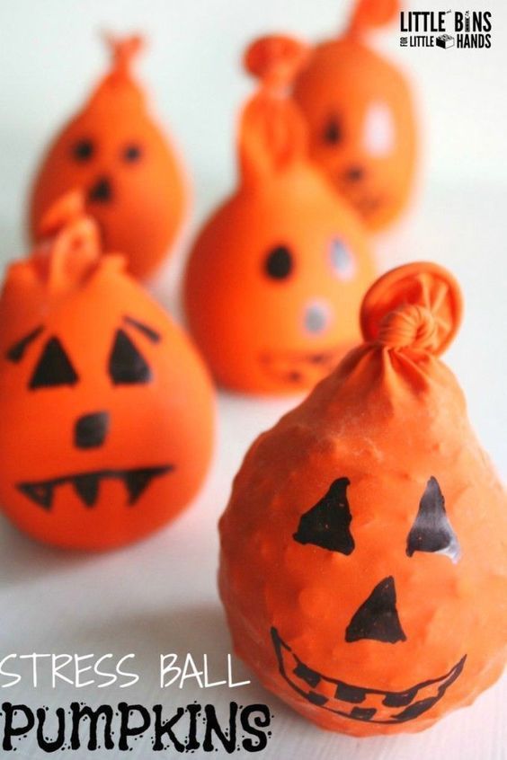 Halloween calm down balls or stress balls made out of balloons. Fun Jack O lante...