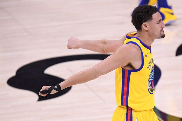 Golden State Warriors' Klay Thompson (11) stretches before playing the Sacra...