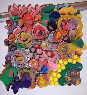 Recycled art by the third graders! We rolled, and rolled..and rolled paper and c...