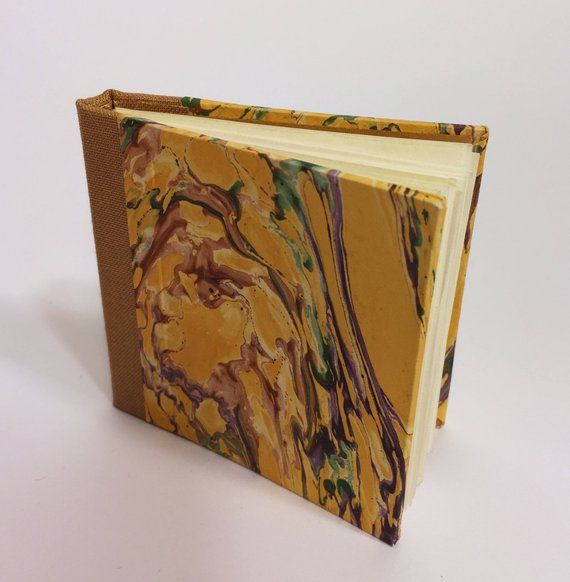 Small hand-bound notebook with marbled cover