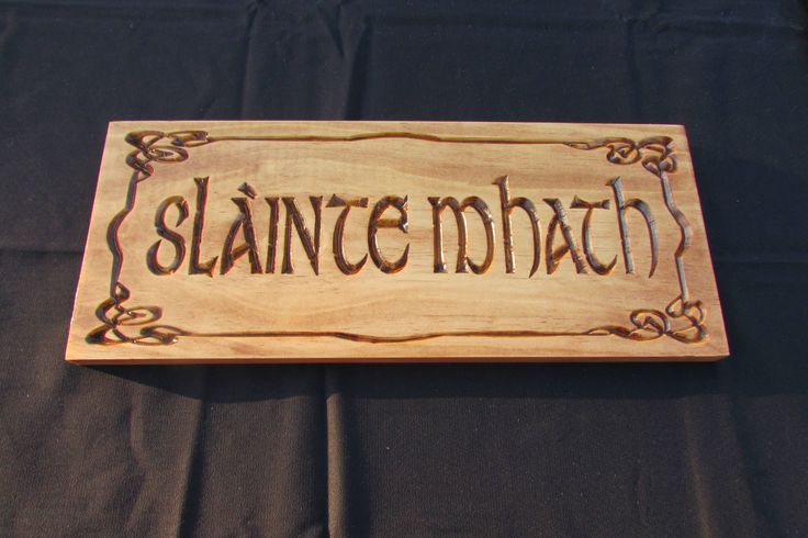 Slainte laser etched sign on weathered board