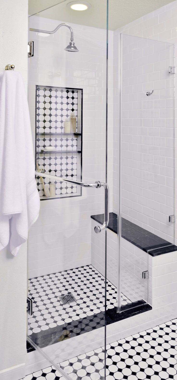 In this shower that is in a separate niche from the rest of the bathroom, a soli...