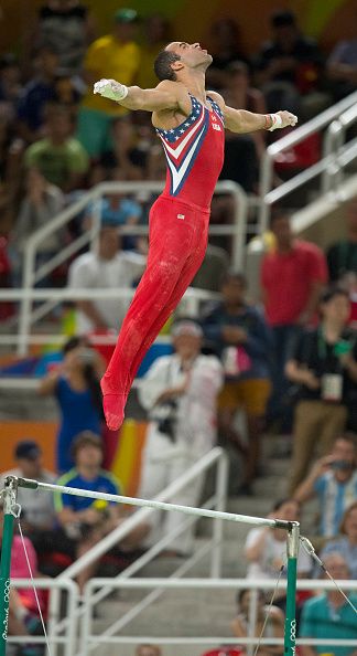 US gymnast Danell Leyva competes on the high bar during the men's gymnastics...
