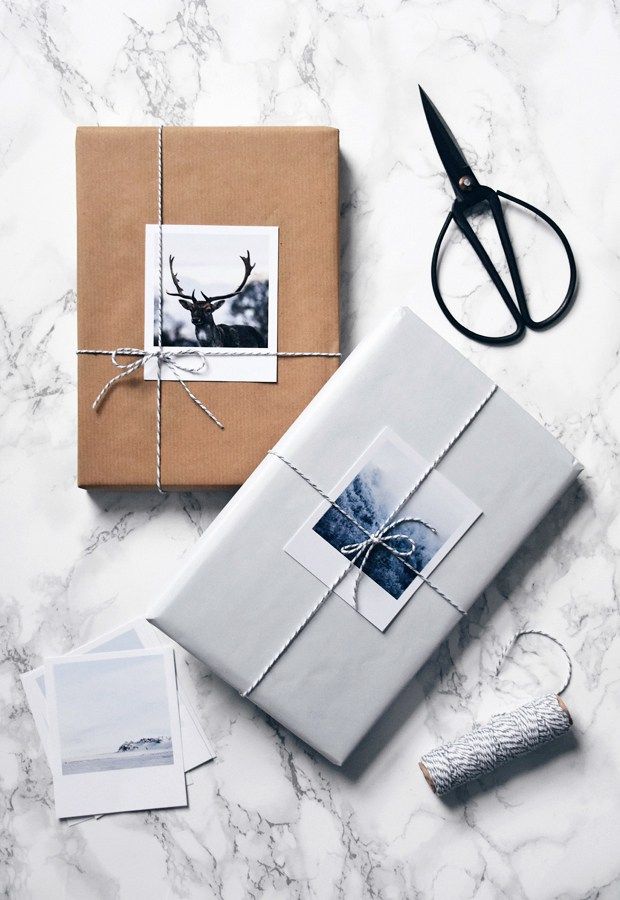 a gift wrapped in brown paper and tied with twine on top of a marble table