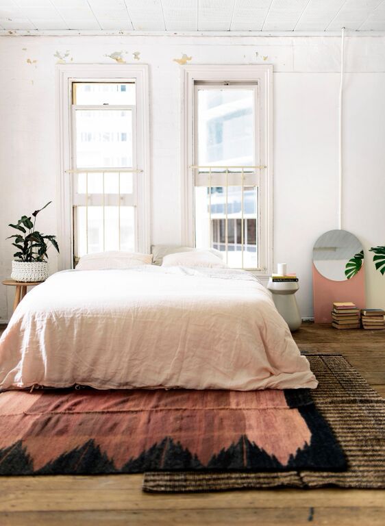 Bohemian Bedroom With Layered Rugs And Indoor Plants Home