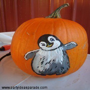 heres a penguin painted on a pumpkin and he is a cute little guy if you are handy with paints and a brush why not paint your pumpkins instead of carving