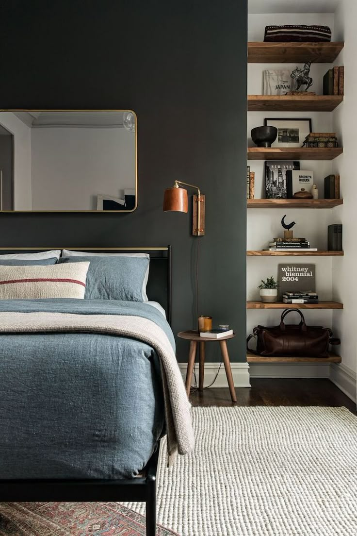 a bed sitting in the middle of a bedroom next to a shelf filled with books