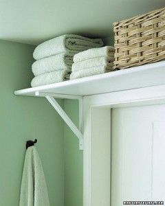 Over-the-door shelf makes the most of every inch of space in a small bathroom.