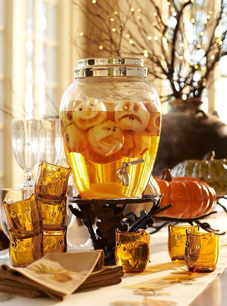cute idea pare apples then cut out faces and add to a clear pitcher apple headapple juiceapple ciderparty ideas for adultshalloween - Halloween Party Table Decorations cute idea pare apples then cut out faces and add to a clear pitcher apple headapple juiceapple ciderparty ideas for adultshalloween - Halloween Party Table Decorations