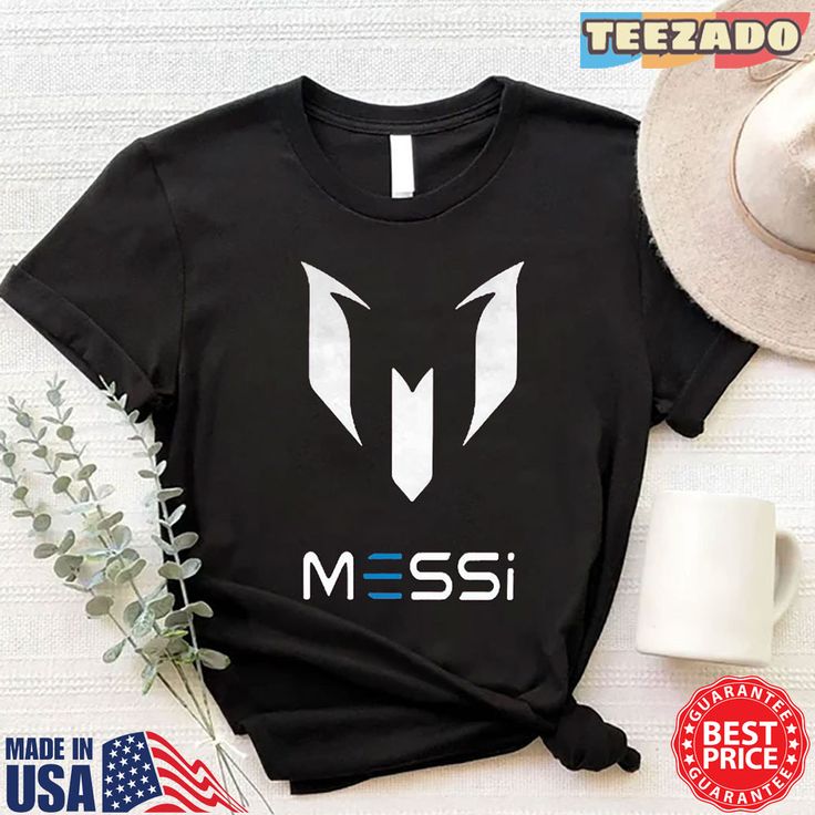 a t - shirt with the word messi on it next to a hat and flowers
