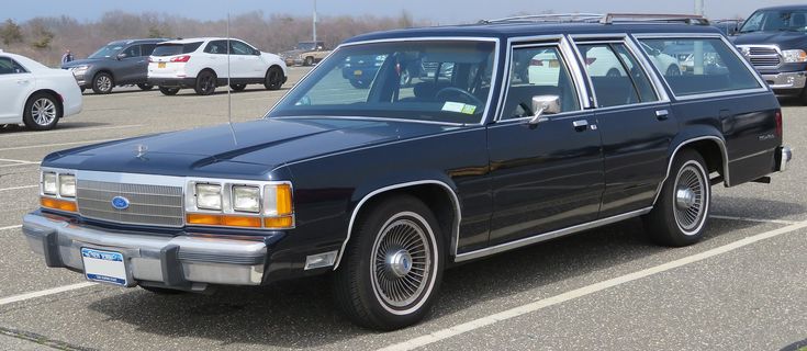 1990 Ford LTD Crown Victoria station wagon. Lack of a hood ornament and 1990 Ford LTD Crown Victoria station wagon. Lack of a hood ornament and