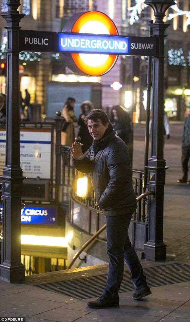 Tom Cruise chats with young assistant on MI5 set in London. Mission Impossible