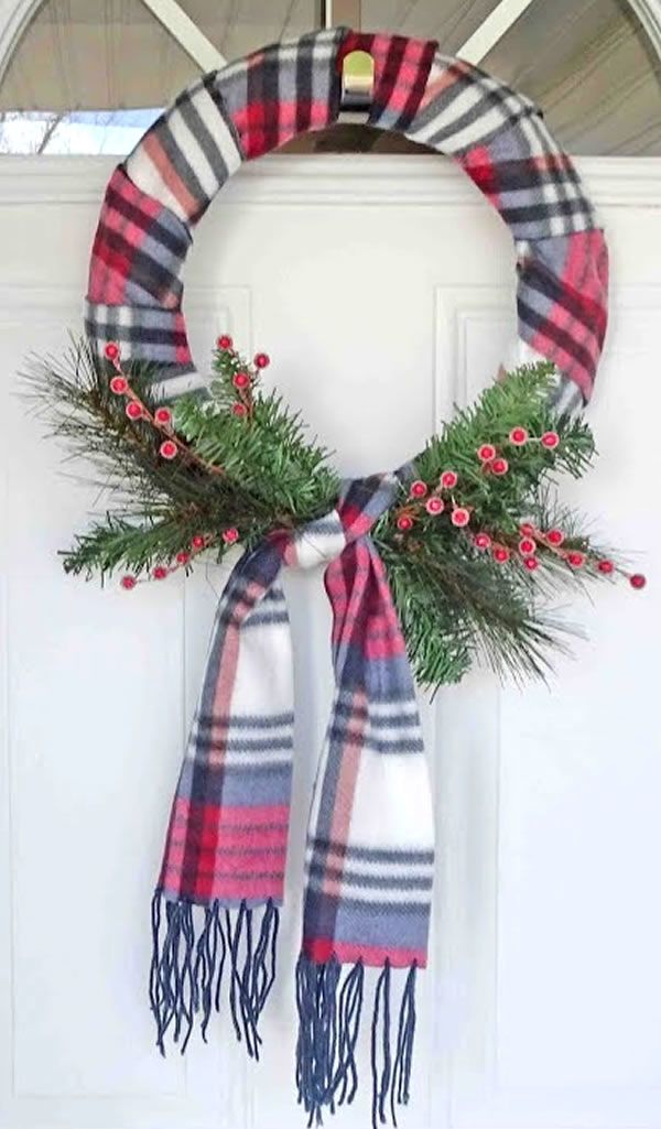 a christmas wreath hanging on the front door