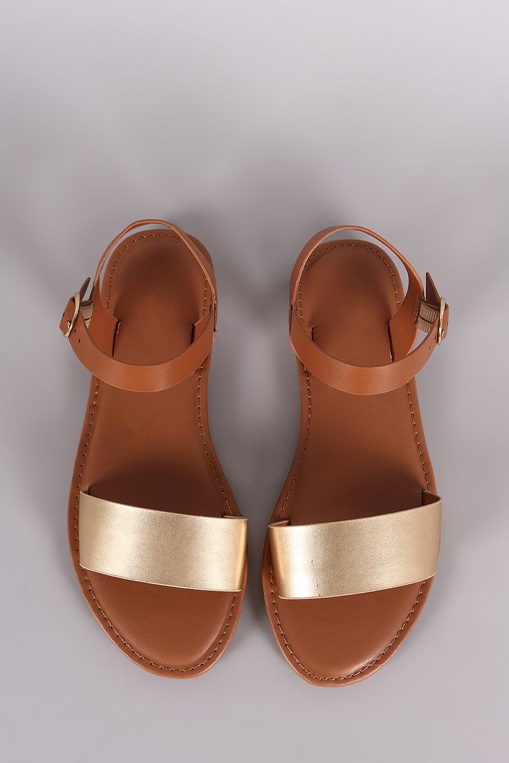Description This flat sandal has a single band across the vamp featuring an adjustable ankle strap Material Vegan Leather manmade Sole Rubber Description This flat sandal has a single band across the vamp featuring an adjustable ankle strap Material Vegan Leather manmade Sole Rubber