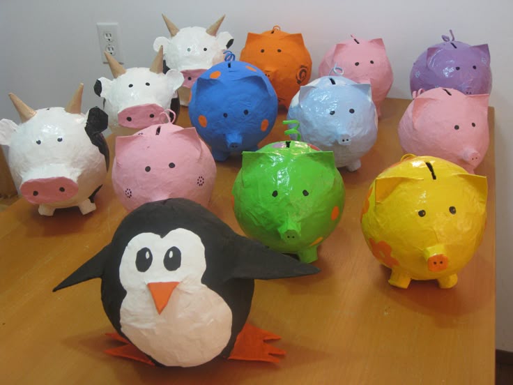 Paper mache piggy bank Construct and decorate your very own paper mache piggy bank. Here's how. Blow up a balloon for each piggy bank you want to make. Have your child tear some newspaper and/or brown paper into 5cm widths (length doesn't matter). Dip each strip of paper in the paper mache glue mixture and wrap the.