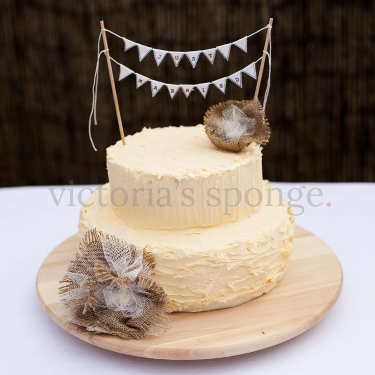 Rustic Finish Buttercream Wedding Cake With Handmade Bunting And Hessian Flowers Rustic Finish Buttercream Wedding Cake With Handmade Bunting And Hessian Flowers