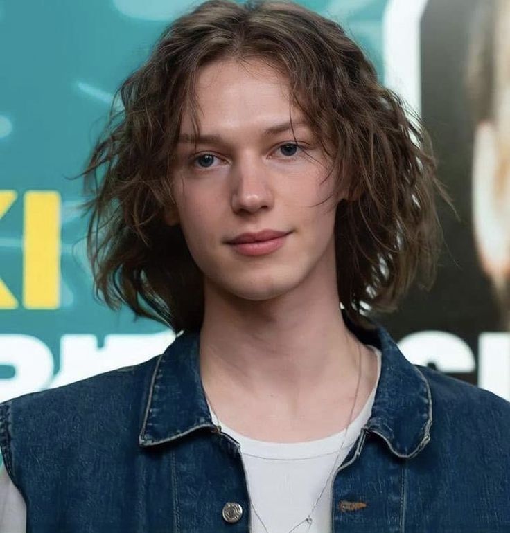 A Close Up Of A Person Wearing A Jean Jacket a-close-up-of-a-person-wearing-a-jean-jacket
