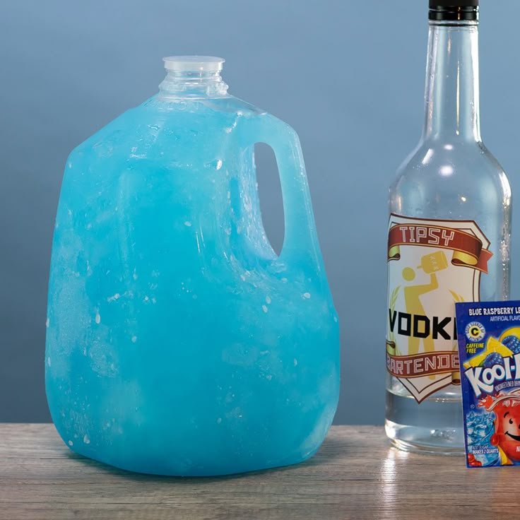 a blue plastic jug next to a bottle of vodka