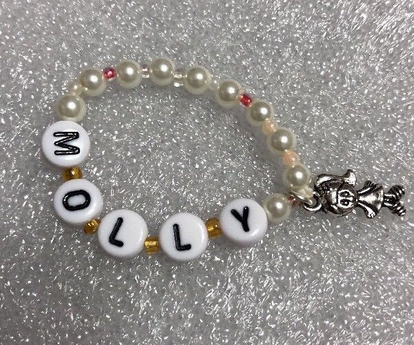 Chatty Cathy ID bracelet black and white letters and white pearls