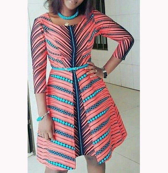 This item is a knee legnth dress designed with sleeves just below...