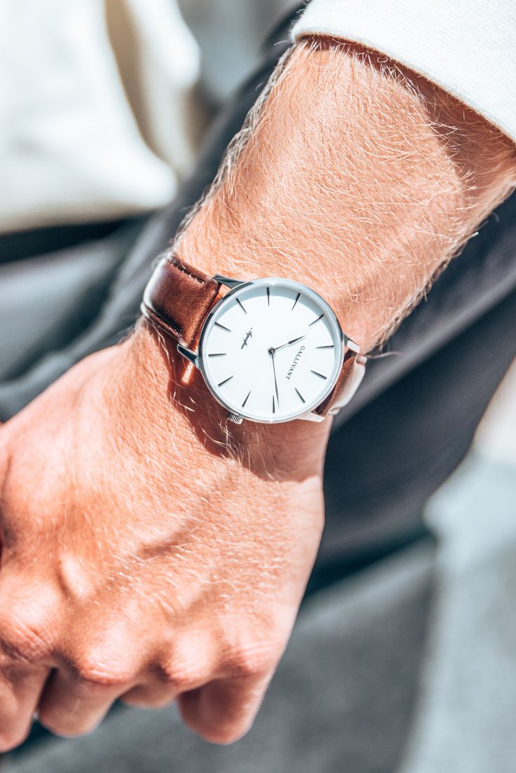 Luxury watches for men in silver, light brown leather strap and white