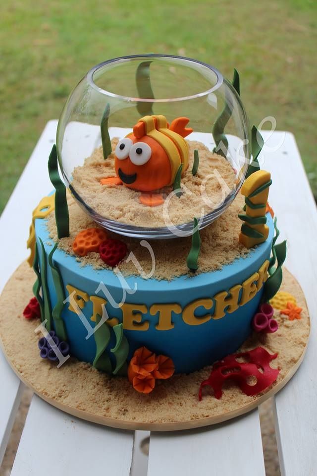 a fish bowl cake with sand in it