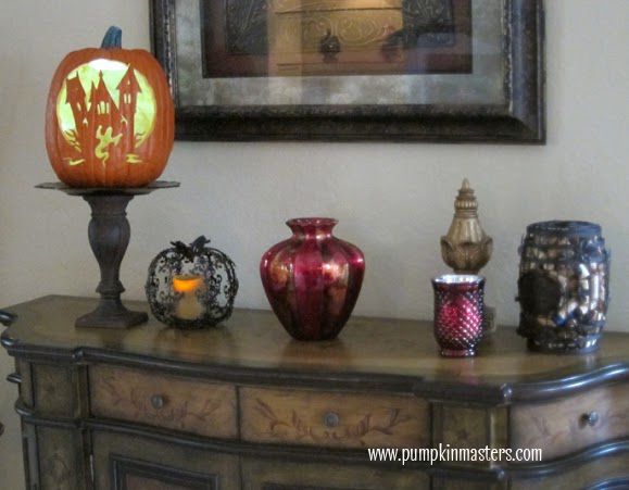 carve a haunted house into the side of an artificial pumpkin in order to save your