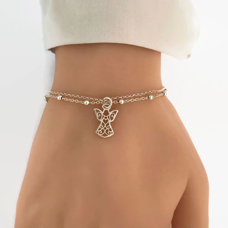 8 inch Round Double Loop Bangle Bracelet with a Guardian Angel charm. 8 inch Round Double Loop Bangle Bracelet with a Guardian Angel charm.