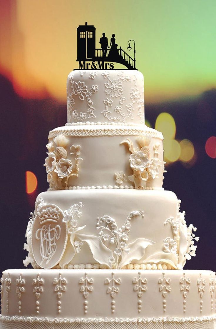 This is an awesome cake topper & following this pin will drop you at a British site with some great links for wedding cake toppers. BUT, I'm pinning this because of the fantabulous CAKE! Yeah, the cake topper can make or break s watching cake but this cake kicks sugary butt! Wow-wee! Gorgeous, just gorgeous. You may now resume you're regularly scheduled Pintrest. === Awesome Wedding Cake Toppers for TV and Film Buffs - Dr Who cake topper