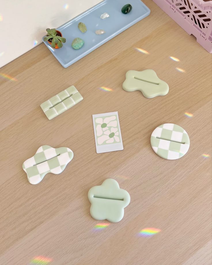Several Pieces Of Plastic Sitting On Top Of A Wooden Table Next To A several-pieces-of-plastic-sitting-on-top-of-a-wooden-table-next-to-a