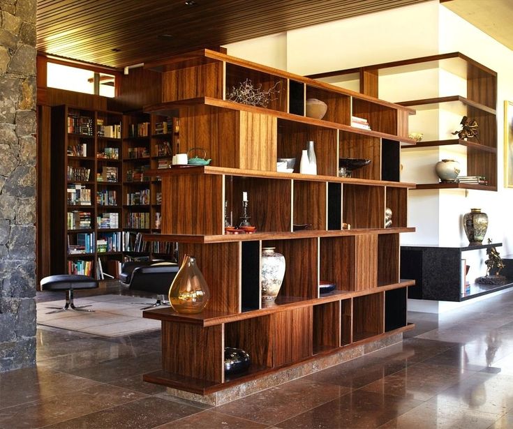 Simple and modern room divider featuring lots of storage compartments Simple and modern room divider featuring lots of storage compartments