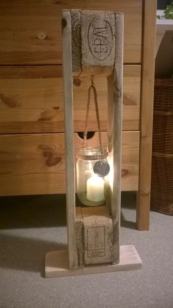 a candle holder made out of an old door