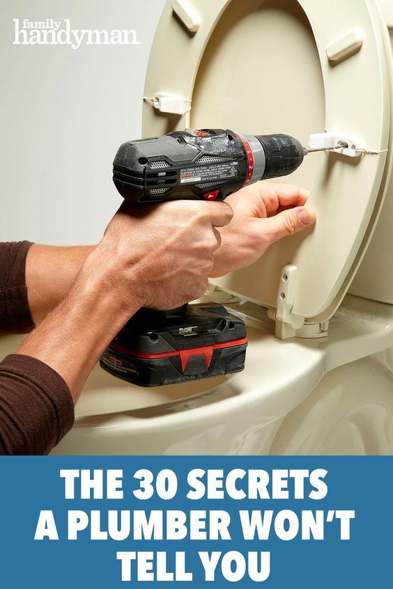 a man is using a drill to fix a toilet with a cordless wrench