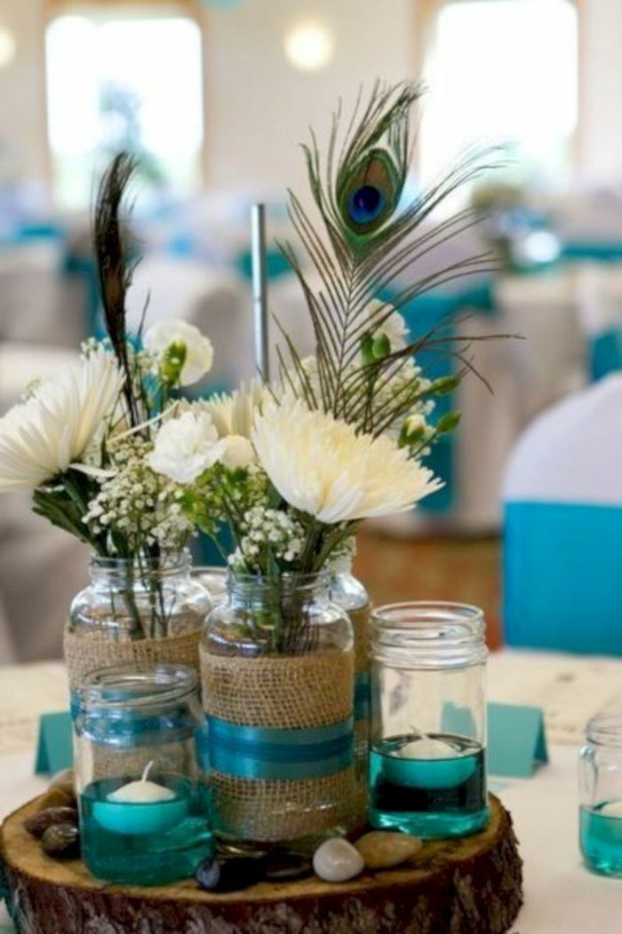 La Plume De Paon Pour Une Décoration Originale Et Inoubliable Déco Mariage Turquoise Mariage Plumes De Paon Mariage En Vert