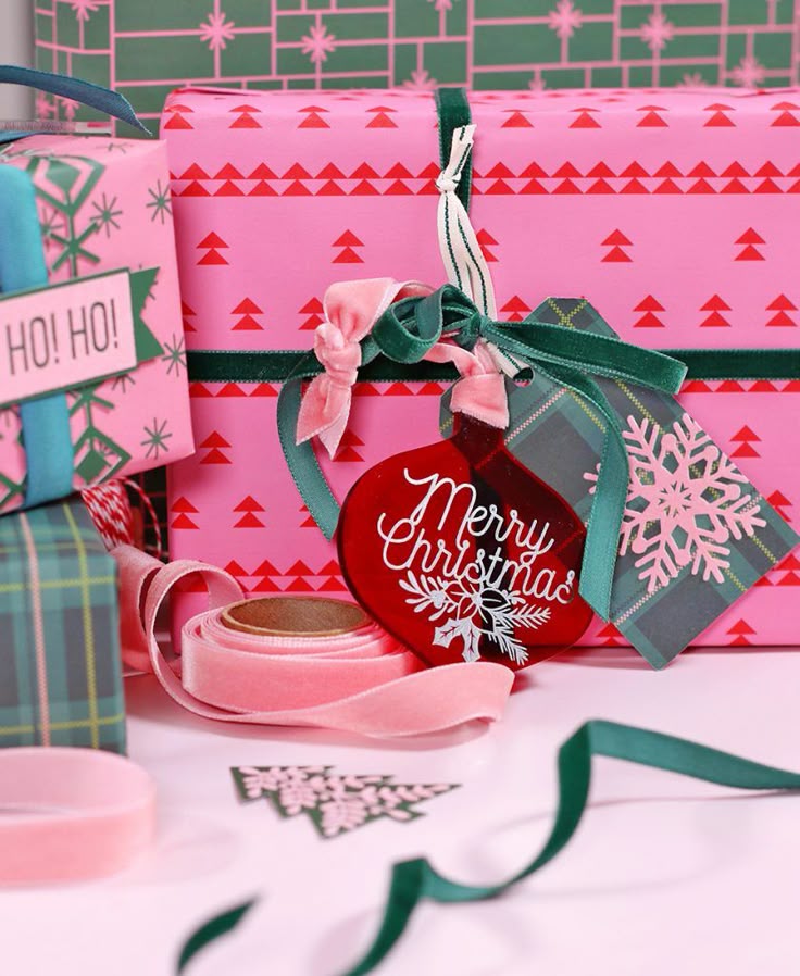 Christmas Presents Are Wrapped In Pink And Green Ribbons christmas-presents-are-wrapped-in-pink-and-green-ribbons