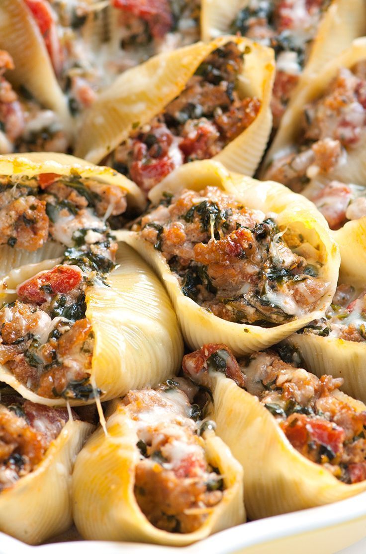 This family-friendly stuffed shells recipe with spinach, sausage, tomato and ric...