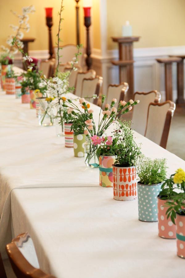 Tin cans wrapped in paper & filled w/ flowers. Great for indoor or ... Tin cans wrapped in paper & filled w/ flowers. Great for indoor or ...