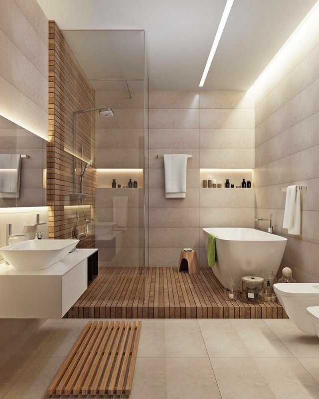 a bathroom with two sinks, a bathtub and a stand up shower in it