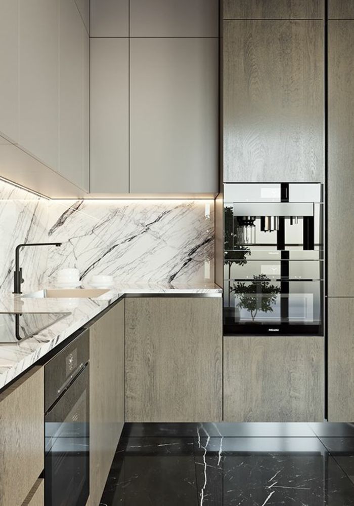 a modern kitchen with marble counter tops and black flooring is featured in this image