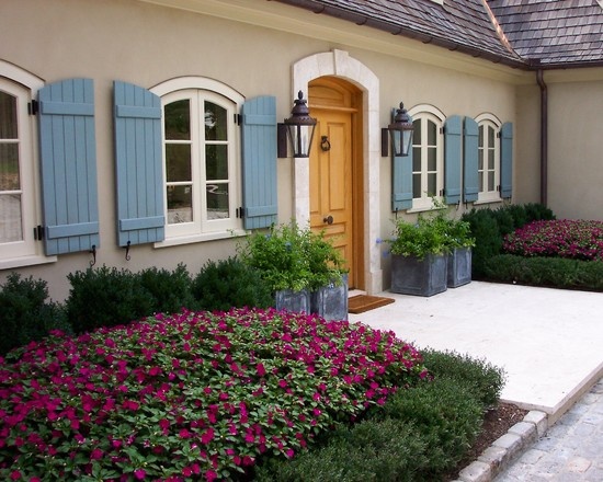 French Country Architecture Cottage Design With Blue Shutters French Country Architecture Cottage Design With Blue Shutters Wrought Iron Lamps And Arched Windows A Decorating Homes Beautiful Places Es