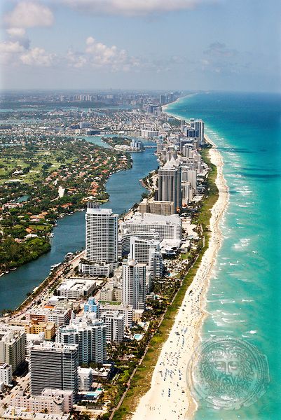 an aerial view of the beach and ocean in miami