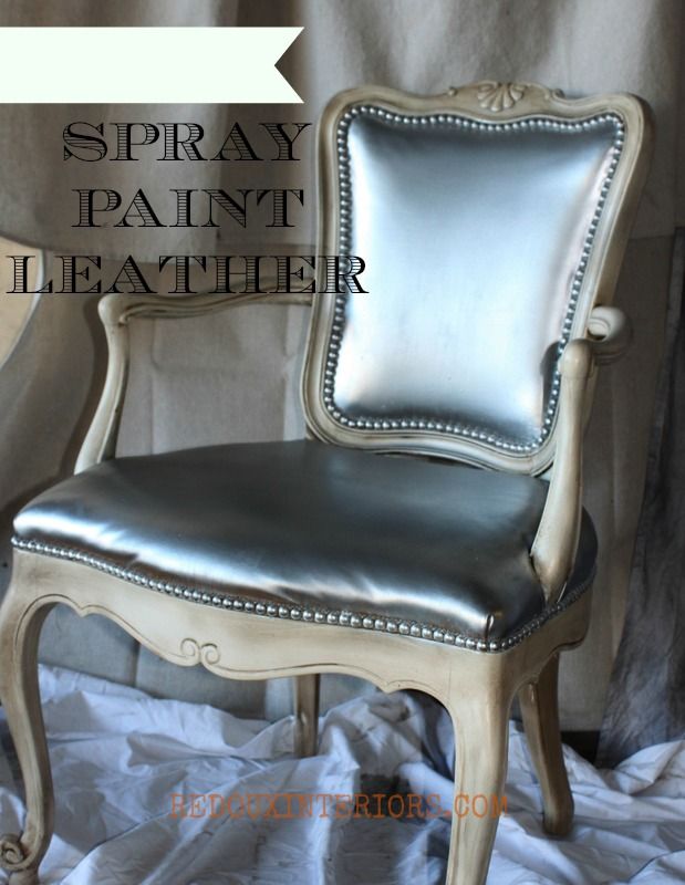 a chair with silver leather upholstered on it