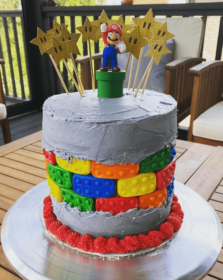 A Birthday Cake Decorated With Legos And Stars Fe965def1e6a7d7fd8a57e78a3960a4d