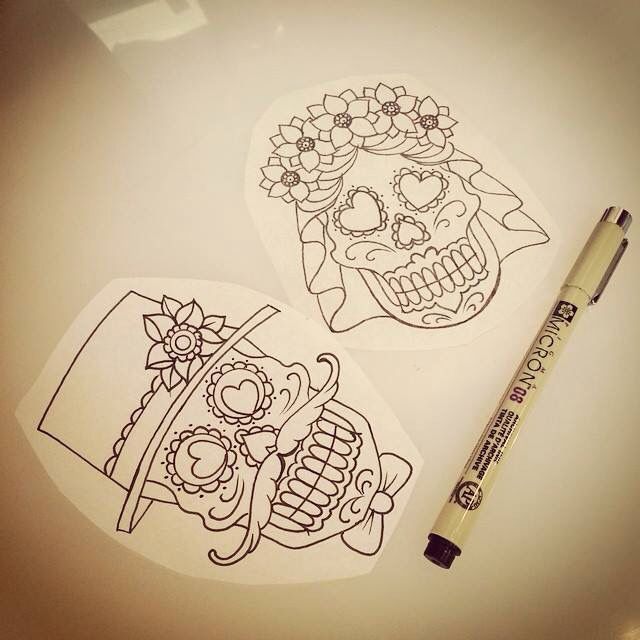 Bride and groom sugar skulls
