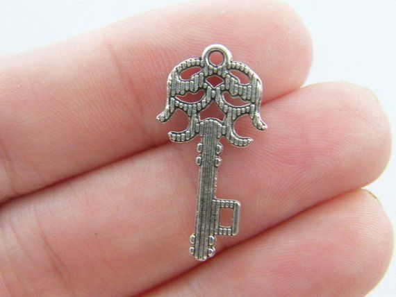 6 Bow charms tibetan silver CT139