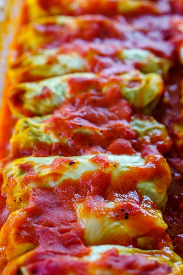 Golumpki or Gołąbki are Polish cabbage rolls that are stuffed with a mixture of beef, pork, rice, and seasoning. This recipe serves 12 and costs just $11.32 to make or $0.95 per serving! Best Cabbage Rolls Recipe, Cabbage Rolls Polish, Polish Stuffed Cabbage, Stuffed Cabbage Recipes, Stuffed Cabbage Casserole, Polish Recipes, Meat Recipes, Casserole Recipes, Cooking Recipes