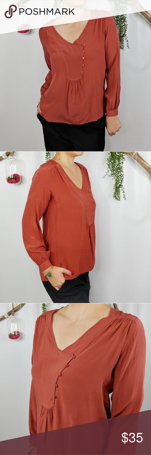 ANTHRO LIL rust orange silk blouse button flap ANTHRO LIL rust orange silk blouse button flap front. Button cuff sleeves. Excellent condition except for very minor blemish by button on front, see last photo. I believe this would come out with dry cleaning and as it is, it's not highly noticeable. Anthropologie Tops Blouses #pintereststyle