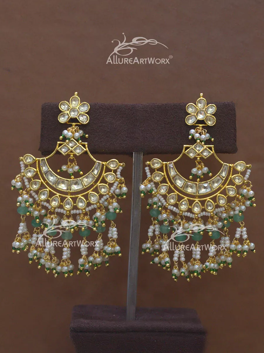 This earrings in yellow kundan,green,stones,and pearls can be worn on traditional attire. Weight of Earrings-30.8gms(approx)both Length of Earrings-70mm/2.75inches(approx)each Kundan Earrings, Traditional Attire, Green Stone, Stones, Pearls, Yellow, Weight, Worn, Rocks